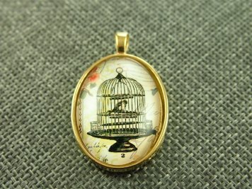 Medalion 3D Kaboszon Ptaszek w klatce 40/25mm kolor złoty 